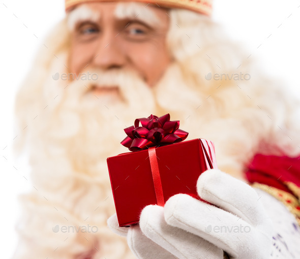 Santa Claus showing gift (Misc) Photo Download