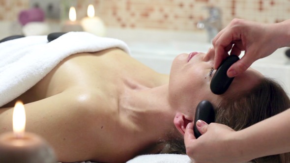 Woman Enjoying Stone Therapy Woman Enjoying Stone Therapy