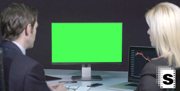 Business Couple Looking At Green Screen Business Couple Looking At Green Screen