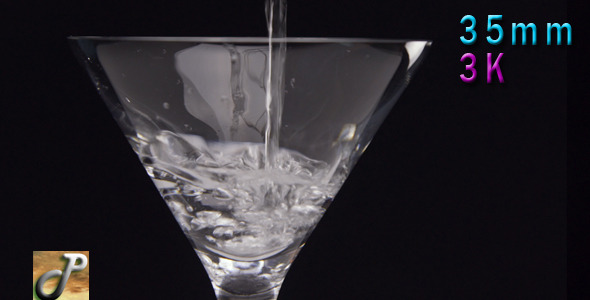 Martini Being Poured Into A Glass Martini Being Poured Into A Glass
