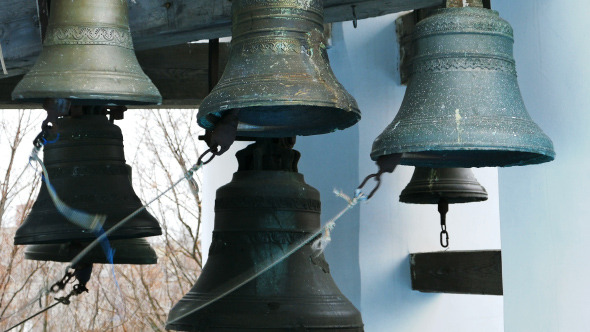 Bell Ringer Plays Church Bells at Belfry Bell Ringer Plays Church Bells at Belfry