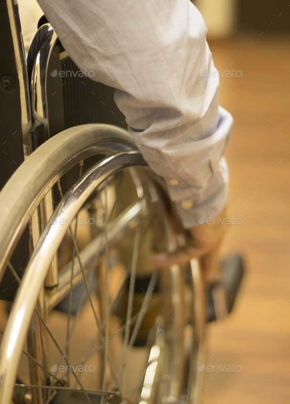 Man in wheel chair in hospital clinic closeup on wheel (Misc) Photo Download