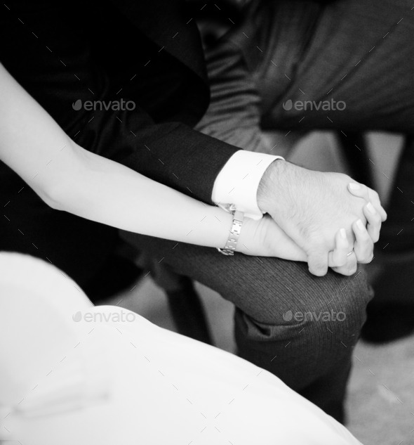 Bride and groom holding hands in wedding marriage ceremony (Misc) Photo Download