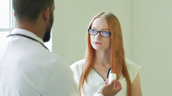 Doctor Shows The Patient Survey Results On The Tab Doctor Shows The Patient Survey Results On The Tab