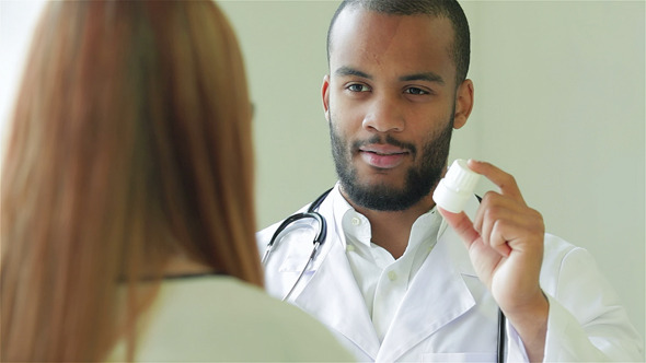 The Doctor Nods At The Reception Of The Patient The Doctor Nods At The Reception Of The Patient