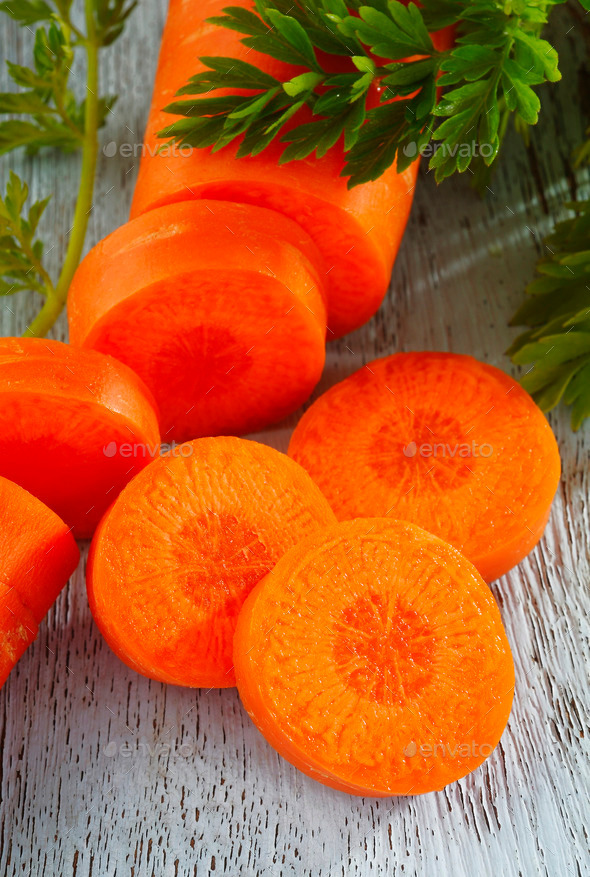 slice carrot on wooden background (Misc) Photo Download