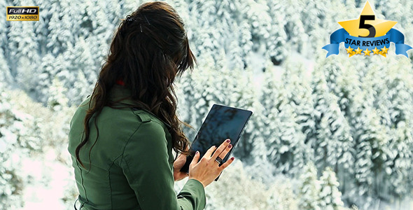 Hands Hold The Tablet in Winter Hands Hold The Tablet in Winter