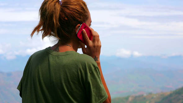 Female Tourist Using Mobile Phone at Mountain 2 Female Tourist Using Mobile Phone at Mountain 2