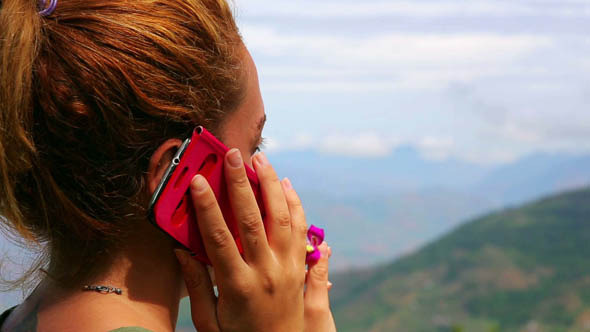 Female Tourist Using Mobile Phone at Mountain 3 Female Tourist Using Mobile Phone at Mountain 3