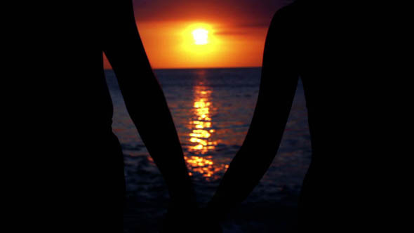 Romantic Couple At Beach During Sunset 1 Romantic Couple At Beach During Sunset 1