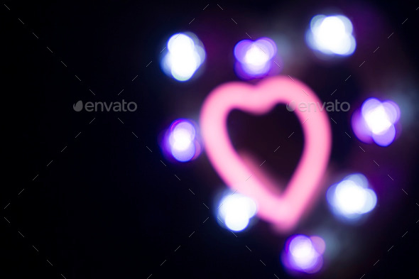 Neon love heart shape sign at night