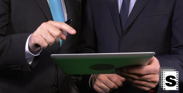 Businessmen Working On Tablet Businessmen Working On Tablet