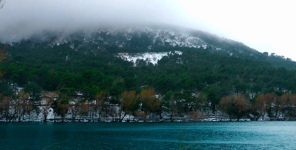 Snow on Mountain and Lake in Winter Snow on Mountain and Lake in Winter