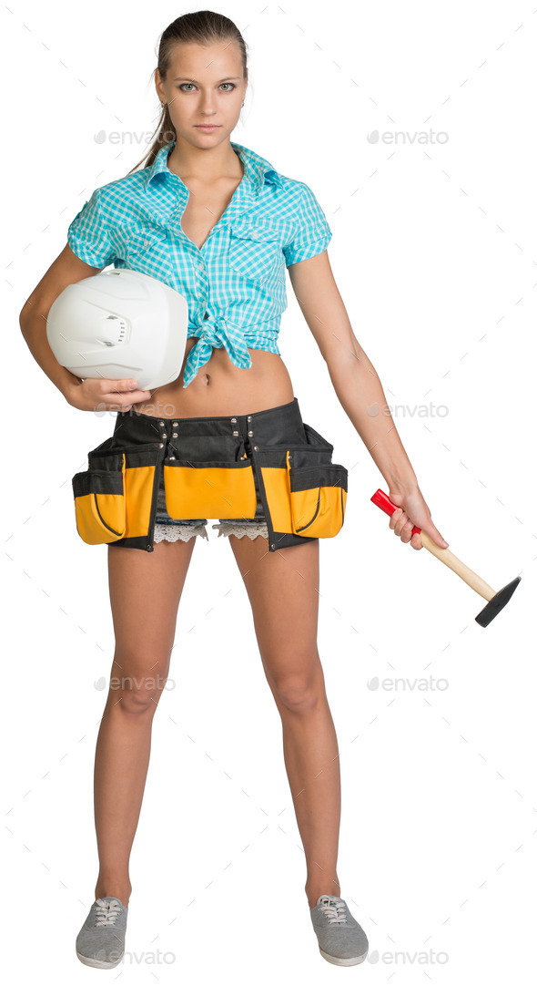 Pretty girl in tool belt holding white helmet and hammer. Full length (Misc) Photo Download