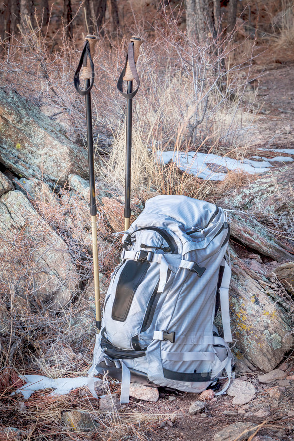 backpack and trekking poles