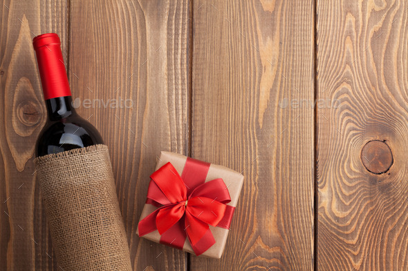 Red wine bottle and valentines day gift box