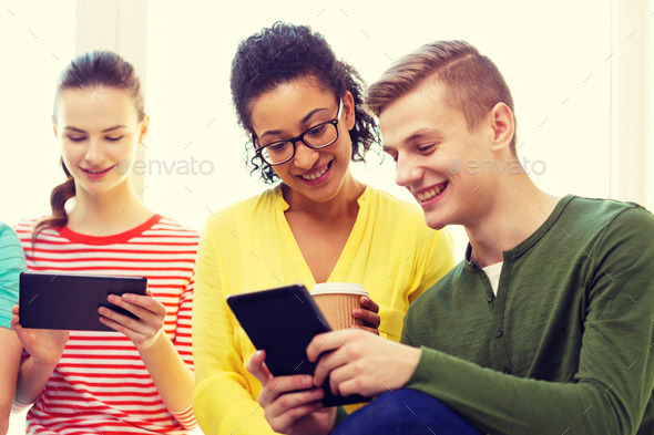 smiling students with tablet pc at school (Misc) Photo Download