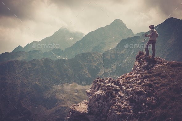 Woman hiker on a top of a mountain (Misc) Photo Download