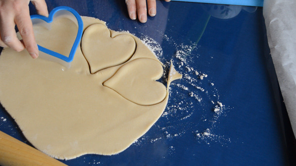 VideoHive Woman Makes Heart Shapes out of Dough 10096619 VideoHive Woman Makes Heart Shapes out of Dough 10096619