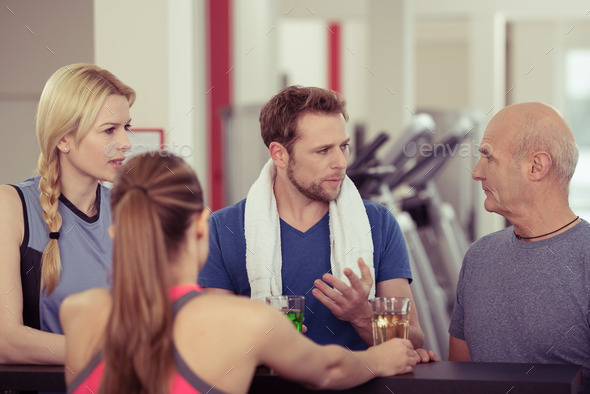 Group of people enjoying refreshments at the gym
