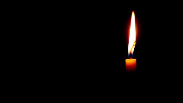 VideoHive One Candle Burning on a Dark Background 10104409 VideoHive One Candle Burning on a Dark Background 10104409