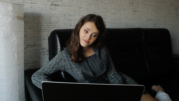 VideoHive Young Woman Working On A Laptop At Home 10108764 VideoHive Young Woman Working On A Laptop At Home 10108764