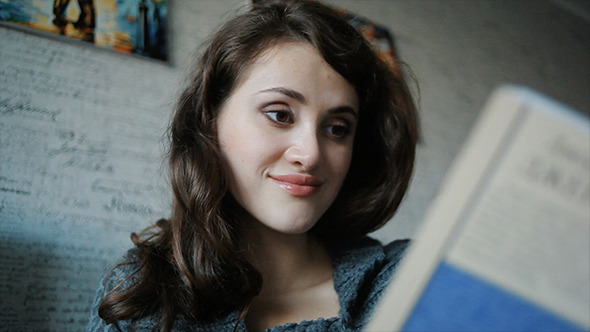 VideoHive Young Woman Reading Book Sitting On The Sofa 10114074 VideoHive Young Woman Reading Book Sitting On The Sofa 10114074