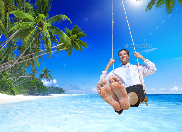 Businessman swinging at Tropical Beach (Misc) Photo Download