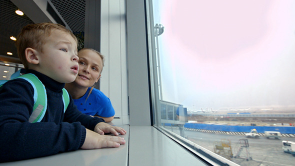 VideoHive Mother And Son Looking Out The Window At Airport 10119323 VideoHive Mother And Son Looking Out The Window At Airport 10119323