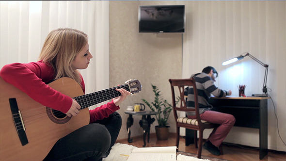 VideoHive Girl Playing At Guitar In Her Home 10119697 VideoHive Girl Playing At Guitar In Her Home 10119697
