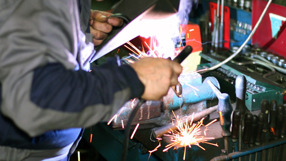VideoHive Welder with Welding Electrode on the Workbench 10135210 VideoHive Welder with Welding Electrode on the Workbench 10135210