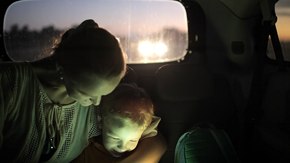 VideoHive Mother And Son Using Touch Pad In Car At Night 10143600 VideoHive Mother And Son Using Touch Pad In Car At Night 10143600