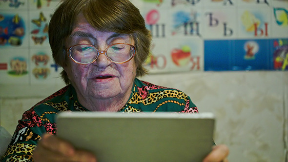 VideoHive Senior Woman Using Touch Pad And Talking 10143642 VideoHive Senior Woman Using Touch Pad And Talking 10143642