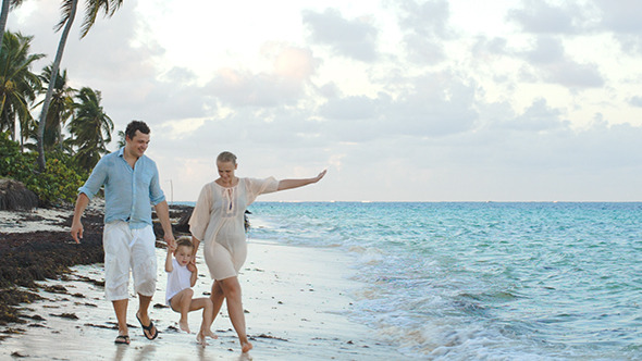 VideoHive Parents And Child Walking Along The Beach Holding 10143751 VideoHive Parents And Child Walking Along The Beach Holding 10143751