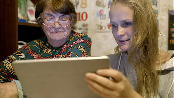 VideoHive Young And Senior Woman Looking Through Photos 10147960 VideoHive Young And Senior Woman Looking Through Photos 10147960