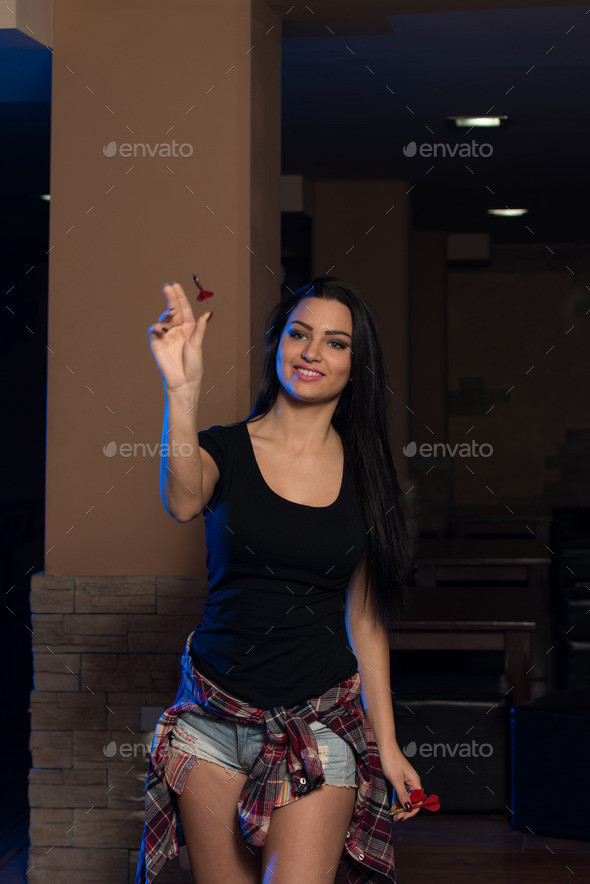 Young Woman Playing Darts