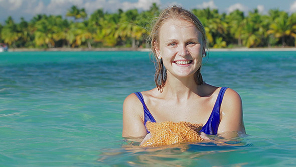 VideoHive Smiling Woman In Sea Water With Starfish 10150189 VideoHive Smiling Woman In Sea Water With Starfish 10150189