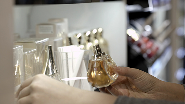 VideoHive Woman Choosing Perfume With Paper Tester 10151054 VideoHive Woman Choosing Perfume With Paper Tester 10151054