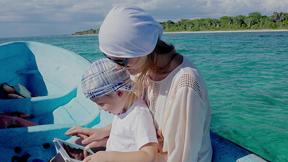 VideoHive Mother And Son Using Pad While Traveling By Sea 10156830 VideoHive Mother And Son Using Pad While Traveling By Sea 10156830