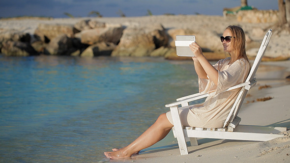 VideoHive Woman With Pad Making Photos Of Sea 10157177 VideoHive Woman With Pad Making Photos Of Sea 10157177