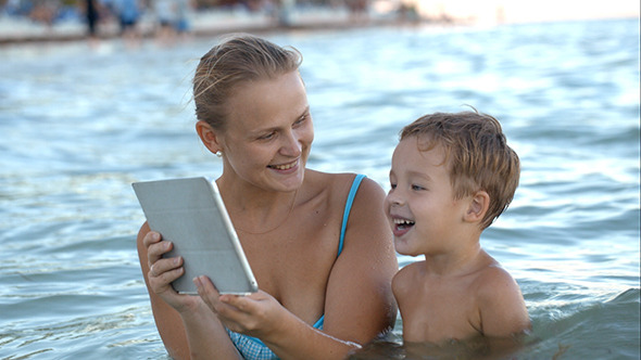 VideoHive Mother With Pad Shows His Son Photo Or Video 10162344 VideoHive Mother With Pad Shows His Son Photo Or Video 10162344