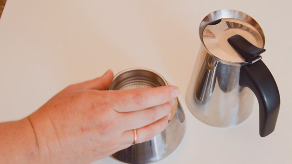 Woman Preparing and Loading Coffee Pot Woman Preparing and Loading Coffee Pot