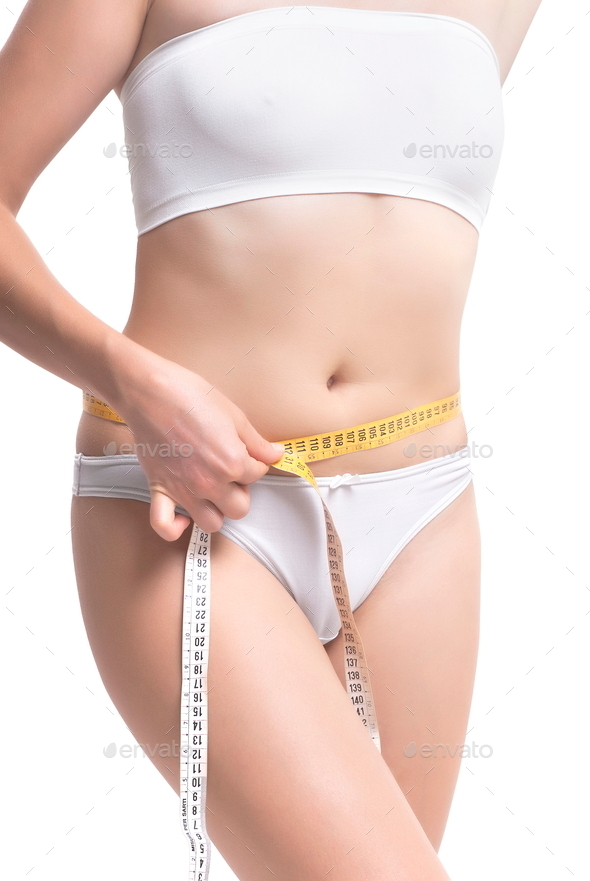 Close-up Of Woman Measuring Her Waistline With Measurement Tape (Misc) Photo Download