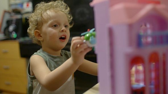 Happy Little Boy Plays With Toy Helicopter Happy Little Boy Plays With Toy Helicopter