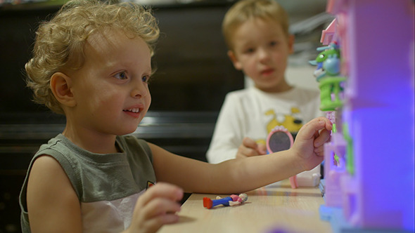 Little Boys Playing With Toy House At Home Little Boys Playing With Toy House At Home