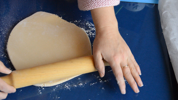 Woman Rolls The Dough Woman Rolls The Dough