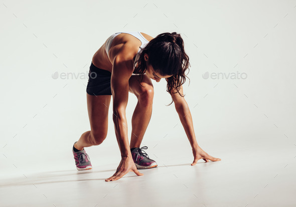 Fit female athlete ready to run