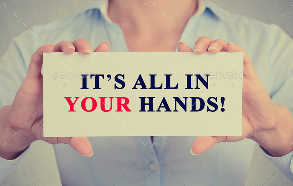 businesswoman hands holding card with It27;s All in Your hands! message