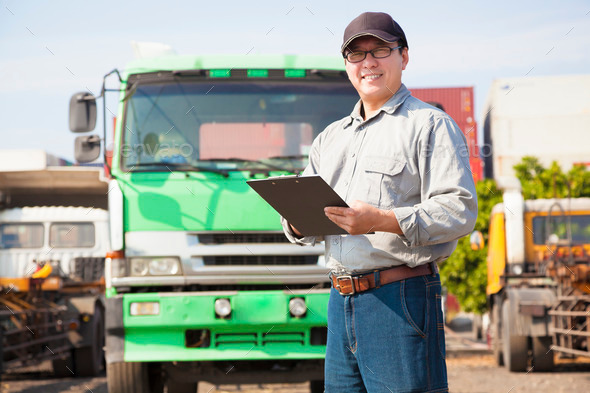 happy truck driver writing on a document