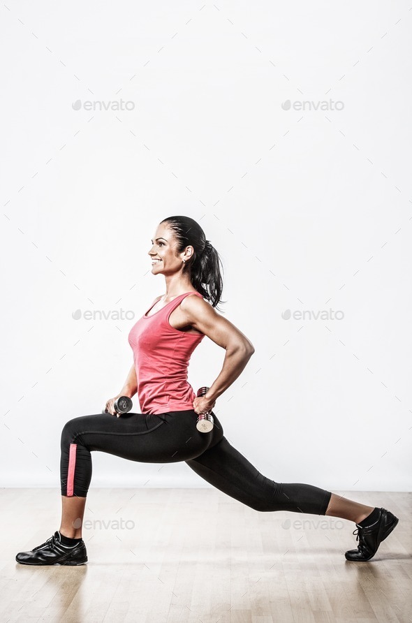 Beautiful woman doing fitness exercise with dumbbells (Misc) Photo Download